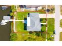 Aerial view showcases the home's location and expansive lot with direct water access at 644 Bayshore Dr, Tarpon Springs, FL 34689