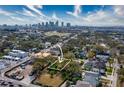 Aerial view of a residential lot with a city skyline in the background, showcasing its prime location at 705 W Amelia Ave, Tampa, FL 33602