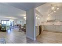 Modern kitchen with white cabinets, quartz countertops, and stainless steel appliances at 4450 Gulf Blvd # 104, St Pete Beach, FL 33706