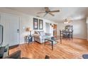 Bright living room featuring hardwood floors and ample natural light at 5157 Beach Se Dr # C, St Petersburg, FL 33705