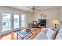 Living room with water views and access to a private balcony at 5157 Beach Se Dr # C, St Petersburg, FL 33705