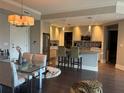 Modern kitchen with island and stainless steel appliances at 200 Main St # 308, Dunedin, FL 34698