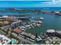 Aerial view of waterfront property, showcasing the building's location and surrounding area at 400 Larboard Way # 106, Clearwater Beach, FL 33767