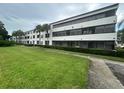 Condo building with expansive lawn at 2587 Countryside Blvd # 6306, Clearwater, FL 33761