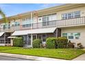 Attractive condo building with well-manicured landscaping at 4001 58Th N St # 16, Kenneth City, FL 33709