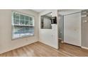 Bright dining area with wood-look floors and view to backyard at 103 Brigadoon Dr, Clearwater, FL 33759