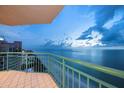 Relax and enjoy the panoramic ocean views from this tiled balcony with a green railing at 1540 Gulf Blvd # 2102, Clearwater Beach, FL 33767