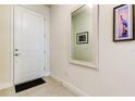 Light and bright entryway with mirror at 2313 Sunset Wind Loop, Oldsmar, FL 34677