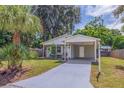 Newly renovated home with carport and landscaped yard at 5733 66Th N Ln, St Petersburg, FL 33709