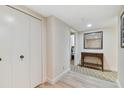 Hallway with tile floors, built in closets, and a console table at 36750 Us Highway 19 N # 15305, Palm Harbor, FL 34684
