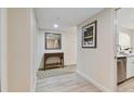 Bright hallway with tile floors and a console table at 36750 Us Highway 19 N # 15305, Palm Harbor, FL 34684