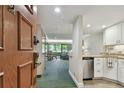 Bright and spacious entryway with kitchen and living room views at 36750 Us Highway 19 # 23-110, Palm Harbor, FL 34684