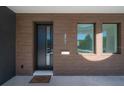Close-up of the front door with modern design elements and a welcoming doormat at 2721 17Th N Ave, St Petersburg, FL 33713