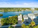 Aerial view of waterfront home with private dock and boat slips at 20051 Gulf Blvd, Indian Shores, FL 33785