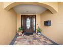 Inviting entryway with a tiled floor and decorative potted plants at 1948 Carolina Ne Ave, St Petersburg, FL 33703