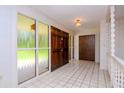 Spacious entryway with tiled floors and double doors at 15350 Scanio Dr, Spring Hill, FL 34610