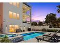 Backyard pool featuring a modern design with an integrated spa and ample lounging space at 2 4Th Ave, Indian Rocks Beach, FL 33785