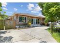 Updated home with wood siding and a large front yard at 4822 3Rd S Ave, St Petersburg, FL 33711
