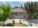 Front view of a charming updated home with a spacious yard at 4822 3Rd S Ave, St Petersburg, FL 33711