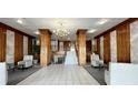 Elegant building lobby with seating and chandelier at 7200 Sunshine Skyway S Ln # 7E, St Petersburg, FL 33711