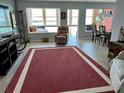 Condo living room with water views and seating at 7200 Sunshine Skyway S Ln # 7E, St Petersburg, FL 33711