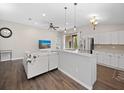Open concept kitchen and living area with modern appliances and island at 2193 Peake St, North Port, FL 34286