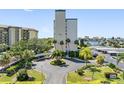 Well-manicured landscaping surrounds the entrance to the building, adding to its curb appeal and beauty at 660 Island Way # 401, Clearwater, FL 33767