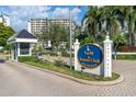 Community entrance with Yacht & Tennis Club sign at 9415 Blind Pass Rd # 803, St Pete Beach, FL 33706