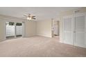 Spacious living room with carpet and sliding glass doors at 3247 38Th S Way # C, St Petersburg, FL 33711