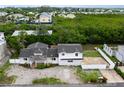 Waterfront property with lush landscaping and canal views at 651 Jungle Queen Way, Longboat Key, FL 34228