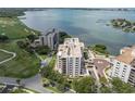 Stunning aerial view of the condo community, golf course, and waterfront at 6 Belleview Blvd # 706, Belleair, FL 33756