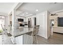 Modern kitchen with granite countertops and stainless steel appliances at 7518 Clanton Trl, Hudson, FL 34667
