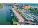 Aerial view of condo complex with pool and waterway access at 18399 Gulf Blvd # 372, Indian Shores, FL 33785