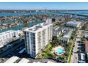 High-rise building with pool and surrounding neighborhood view at 400 Island Way # 308, Clearwater, FL 33767