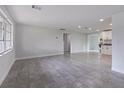 Bright and spacious living room with tile floor at 6840 Runnel Dr, New Port Richey, FL 34653