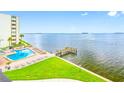 A beautiful waterfront condo featuring a pool and dock with access to the stunning bay views at 300 Woodette Dr # 202B, Dunedin, FL 34698
