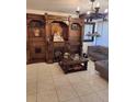 Living room features built-in shelving and a large chandelier at 895 N Village N Dr # 204, St Petersburg, FL 33716