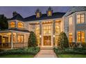 Grand brick house with a circular driveway at dusk at 2901 Leprechaun Ln, Palm Harbor, FL 34683