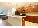Modern kitchen with granite countertops and stainless steel appliances at 105 Cascade Bend Dr, Ruskin, FL 33570
