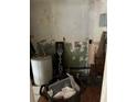 Small laundry area with water heater and storage at 2317 8Th E Ave, Bradenton, FL 34208
