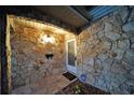 Front entry with stone facade and ADT security system at 824 62Nd Ne Ave, St Petersburg, FL 33702