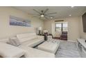Living room with sectional sofa and access to a small bedroom at 5245 Amulet Dr # 306, New Port Richey, FL 34652