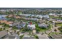 Aerial view of a waterfront home in a residential community at 709 Manns Harbor Dr, Apollo Beach, FL 33572