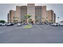 Large building with parking lot at 880 Mandalay Ave # C713, Clearwater Beach, FL 33767