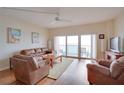 Living room with ocean view and hardwood floors at 880 Mandalay Ave # C713, Clearwater Beach, FL 33767