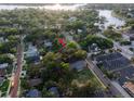 House nestled amongst lush vegetation near a waterway at 55 W Lemon St, Tarpon Springs, FL 34689