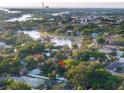 House nestled amongst lush vegetation near a waterway at 55 W Lemon St, Tarpon Springs, FL 34689