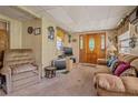 Living room with couch and chair, vintage decor at 7313 S Obrien St, Tampa, FL 33616