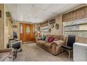 Living room with couch, chair, and vintage television at 7313 S Obrien St, Tampa, FL 33616