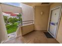 Small entryway or balcony with a door and view of a courtyard at 6141 Bahia Del Mar Blvd # 232, St Petersburg, FL 33715